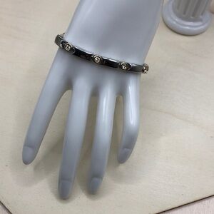 Manhattan silver tone metal tennis style lined bracelet, classic, timeless.